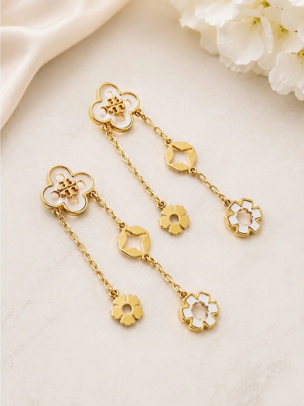 Tory Burch forget me not drop earrings.